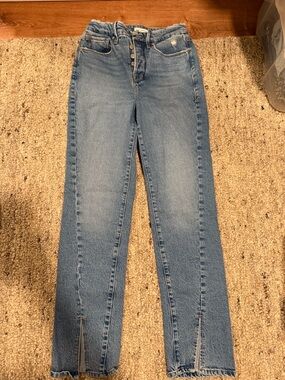 Good American button fly high rise jeans, front slit